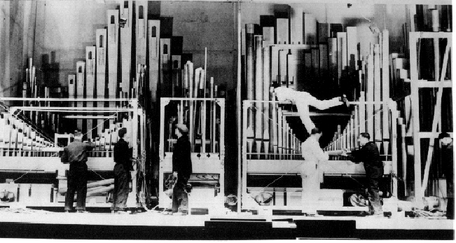 Organ chests and pipes being setup in theatre