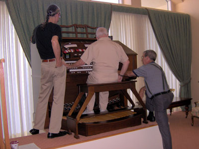 Click here to download a 2048 x 1536 JPG image of Doctor Morrell giving the organ a final check as Tom Hoehn and the Bone Doctor look on.