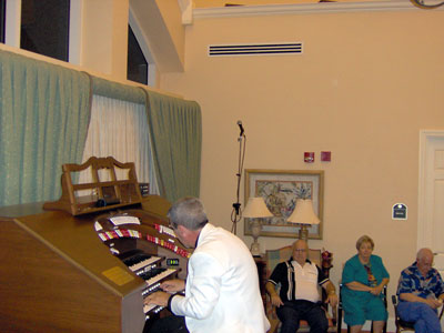 Click here to download a 2048 x 1536 JPG image of Tom at the console while a very proud Papa Bill, Janet and Doctor Morrell listen intently.